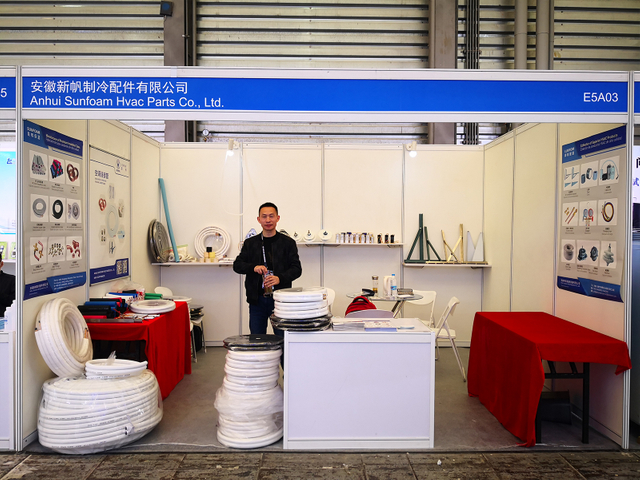 Visitors exploring Lukwom's booth during a trade exhibition