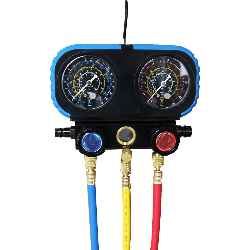 HVAC technician using a manifold gauge set for system diagnostics